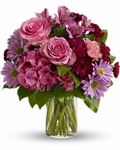 If you want to make a vivid impression, send flowers in glorious shades of pink, maroon and lavender stunningly arranged in a sparkling clear glass cylinder vase. So much beauty for such a beautifully reasonable price tag.

The dramatic bouquet includes pink hydrangea, pink roses, fuchsia carnations, pink carnations, miniature maroon carnations, purple alstroemeria and lavender chrysanthemums.