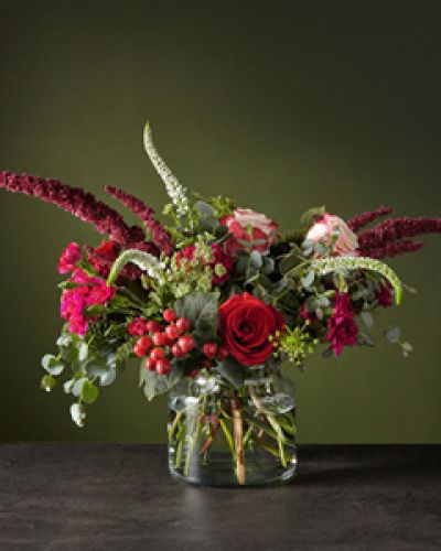 Escape the cold with this wild Reverie bouquet, that's just bursting with white veronica and red upright amaranthus stems. Between the lively design and rustic-chic palette, every day with these blooms will bring new, upbeat energy.