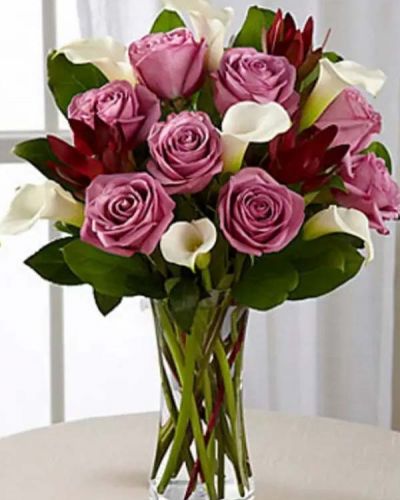 <p>Picked fresh from the farm to create that perfect impression, the Charm & Grace Bouquet features an enchanting color combination of lavender, white and green. This floral stunner is the perfect way to celebrate a birthday, anniversary, or to let them know how much you appreciate their place in your life.</p>
