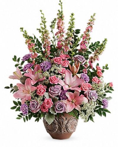 <div class="m-pdp-tabs-description">
<div id="mark-1" class="m-pdp-tabs-marketing-description">A touching tribute to a beloved woman, this beautiful, soft pink and lavender arrangement is presented in a large antiqued pot for an elegant touch.</div>
</div>
<p id="arrngDescp">This soft pink arrangement features lavender roses, pink spray roses, pink asiatic lilies, lavender carnations, pink larkspur, queen anne's lace, huckleberry, dusty miller, and leatherleaf fern.</p>