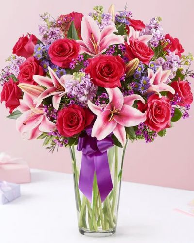 <p>A gift means so much more when it comes from the heart. Our Valentine’s bouquet delivers on that sentiment, with radiant pink and purple blooms arranged in a glass cylinder vase. Finished with a purple satin ribbon, it’s a surprise that speaks volumes about how you feel.</p>