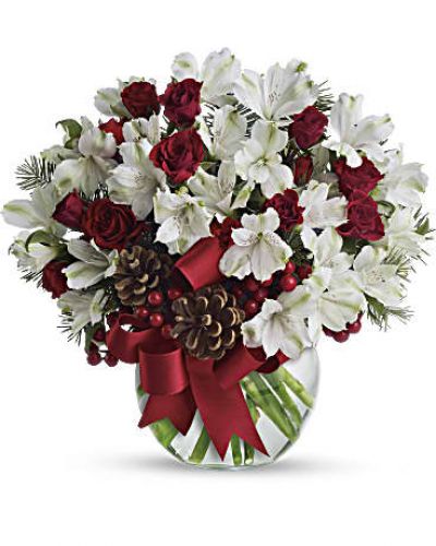 <p>Fresh as new fallen snow. Delicate, snow white flowers are decorated with berries and pinecones for a unique spin on tradition. Presented in a crystal clear bowl tied with red ribbon, this Christmas floral arrangement is exceptionally value priced.<br />
White alstroemeria and Douglas fir are mixed with pinecones and red berries in a clear bowl decorated with red satin ribbon.</p>