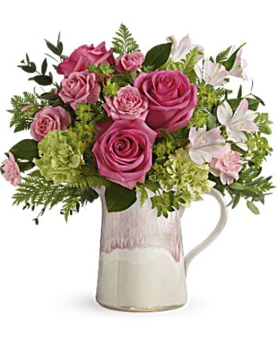 <div id="mark-3" class="m-pdp-tabs-marketing-description">Make their heart flutter with an extra special delivery! Hot pink roses and fresh greens look oh-so-chic in this stylish stoneware pitcher, featuring an iridescent reactive glaze in the prettiest shade of pink. It's food-safe for years of enjoyment!</div>
<p>Hot pink roses, pink spray roses, light pink alstroemeria, green carnations and pink miniature carnations are arranged with bupleurum, leatherleaf fern, and parvifolia eucalyptus.</p>