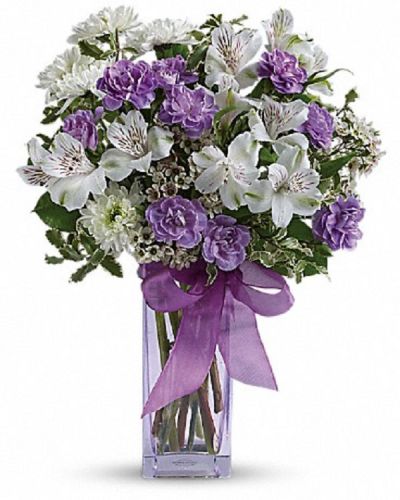 <div class="m-pdp-tabs-description">
<div id="mark-1" class="m-pdp-tabs-marketing-description">Fill their heart with laughter! The ultimate lavender-lover's bouquet, this gleeful gift of white and lavender blooms is delivered in a pretty pale lavender vase she'll cherish forever. Lavender organza ribbon adds that gifting touch.</div>
</div>
<p id="arrngDescp">Includes white alstroemeria, miniature lavender carnations, white chrysanthemums and waxflower, accented with fresh pittosporum and lemon leaf.</p>