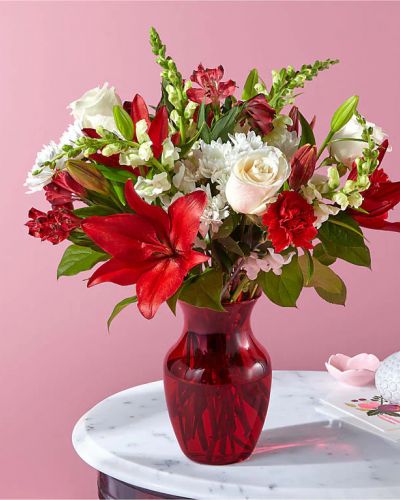 <p>The perfect date isn't complete without classic rose blossoms, romantic white snapdragons, red carnations, and more dreamy flowers to show your affection. Please Note: The bouquet pictured reflects our original design for this product. While we always try to follow the color palette, we may replace stems to deliver the freshest bouquet possible, and we may sometimes need to use a different vase.</p>