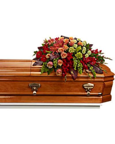<div id="mark-1" class="m-pdp-tabs-marketing-description">Bring majesty to the service with this gorgeous casket spray of orange roses and lilies and other brilliantly colored floral favorites. A touching tribute for someone special.</div>
<div id="desc-1">
<ul>
<li>The magnificent arrangement includes green miniature hydrangea, orange roses, dark orange asiatic lilies, red gerberas, red gladioli, green carnations and bells of Ireland, accented with assorted greenery.</li>
</ul>
</div>