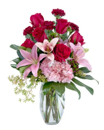 <p>When only the best will do, send this regal display of rich red roses, blush pink Asiatic lilies and hydrangea, deep burgundy carnations and sweet William. The bouquet is designed in a clear glass vase and beautifully collared with rich green foliage.</p>